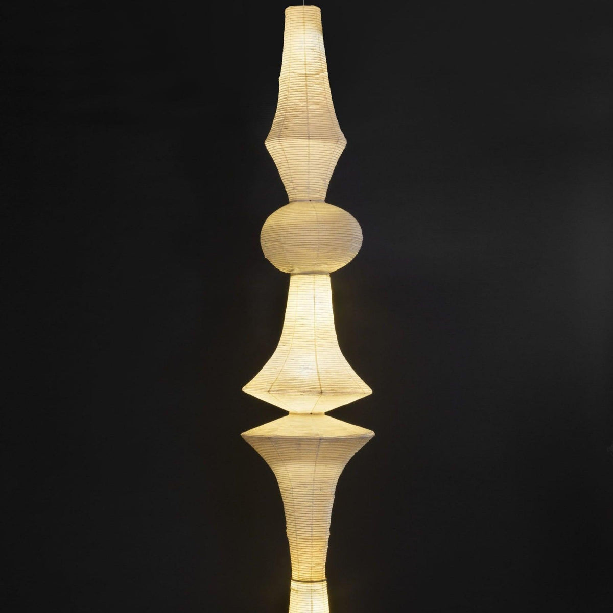 Vertical Sculptural Pendant Light With Warm Paper Glow
