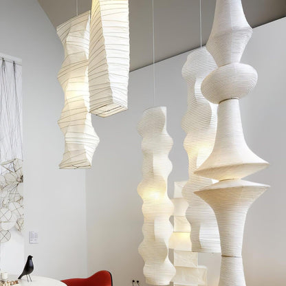 Vertical Sculptural Pendant Light With Warm Paper Glow