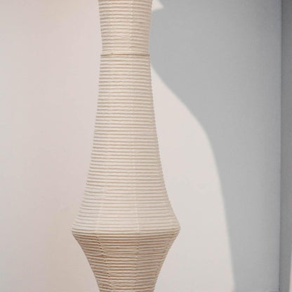 Vertical Sculptural Pendant Light With Warm Paper Glow