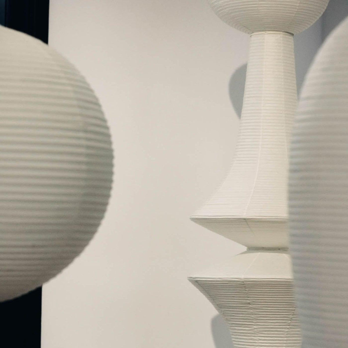 Vertical Sculptural Pendant Light With Warm Paper Glow