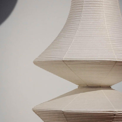 Vertical Sculptural Pendant Light With Warm Paper Glow