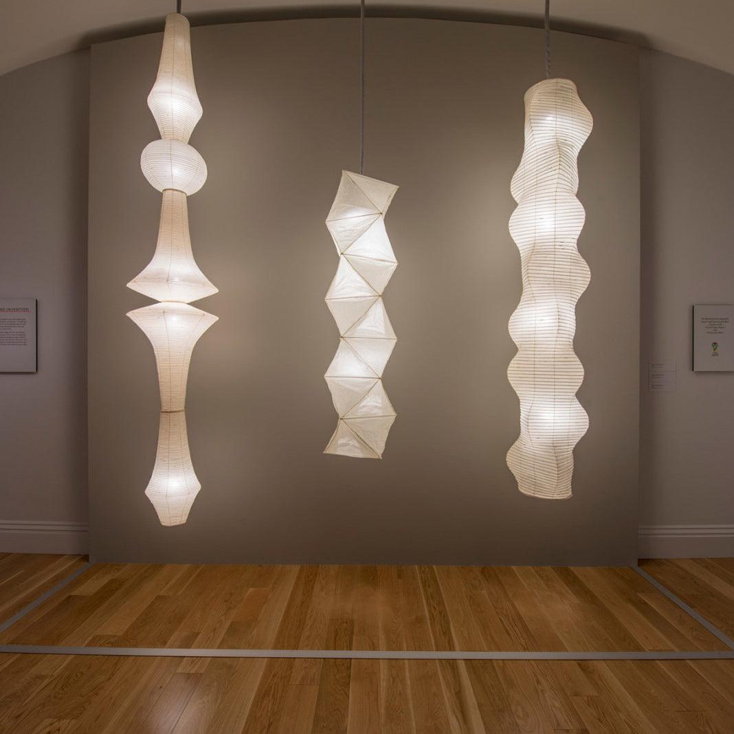 Vertical Sculptural Pendant Light With Warm Paper Glow