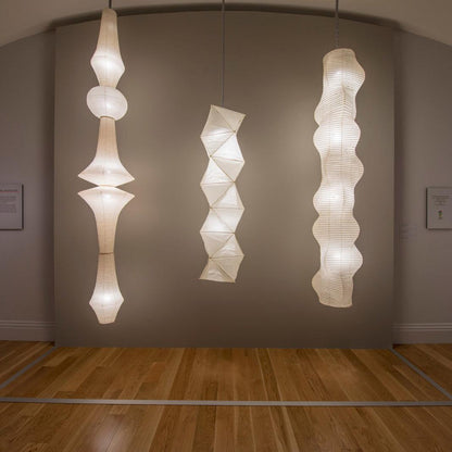 Vertical Sculptural Pendant Light With Warm Paper Glow