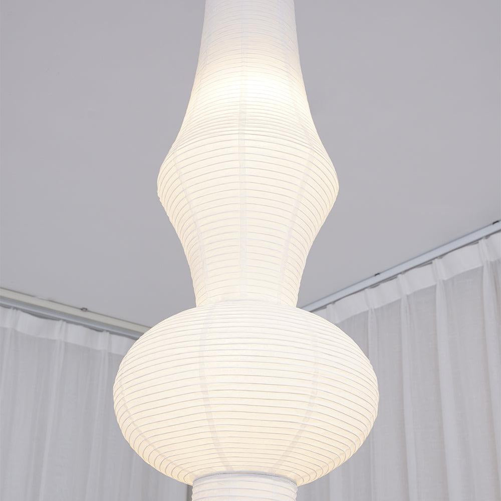 Vertical Sculptural Pendant Light With Warm Paper Glow