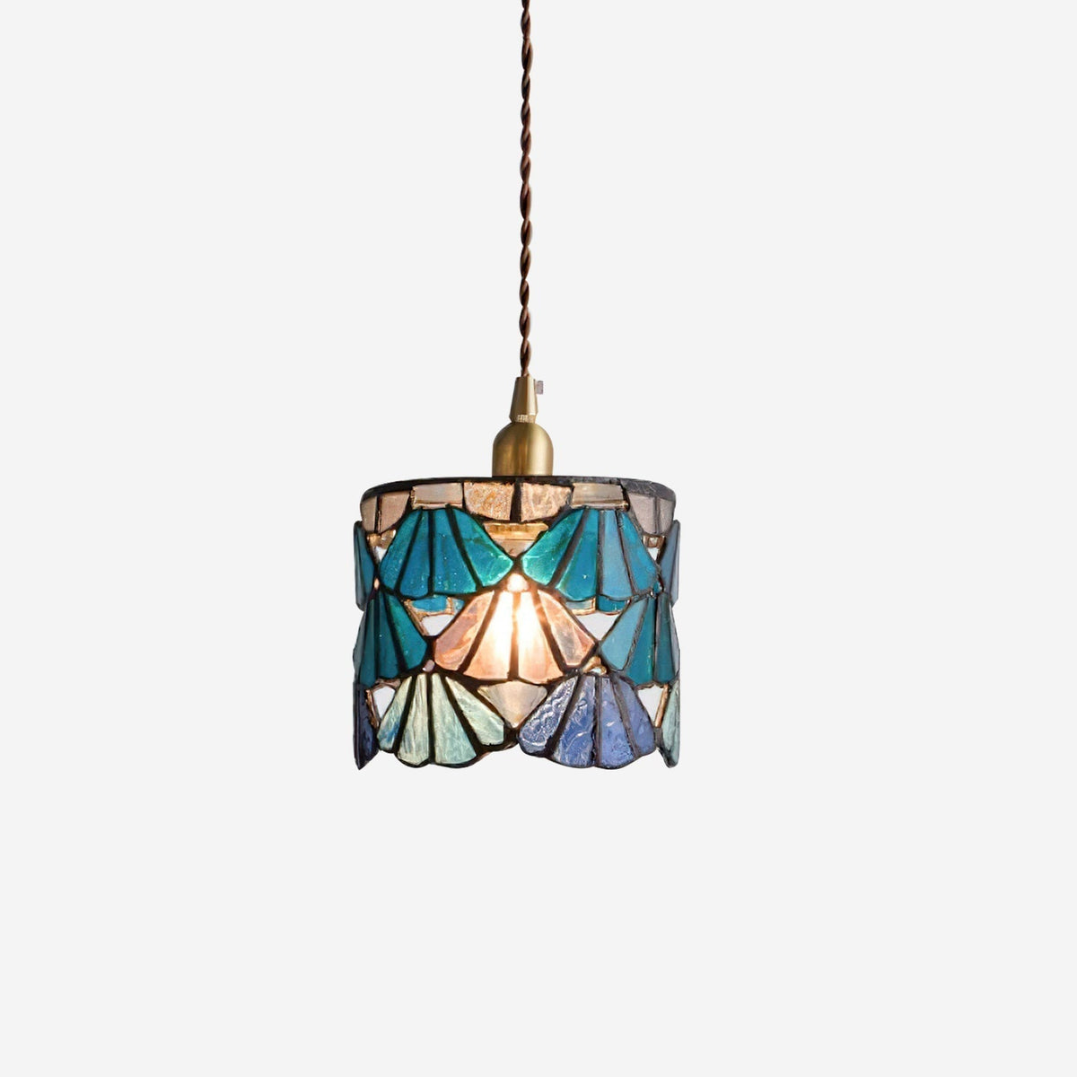 Pendant Light With Brass Accents And Glass Shade For Warm Glow
