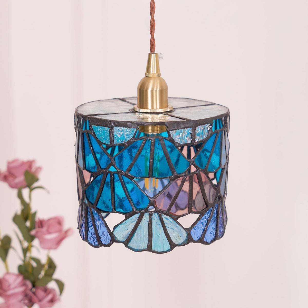 Pendant Light With Brass Accents And Glass Shade For Warm Glow