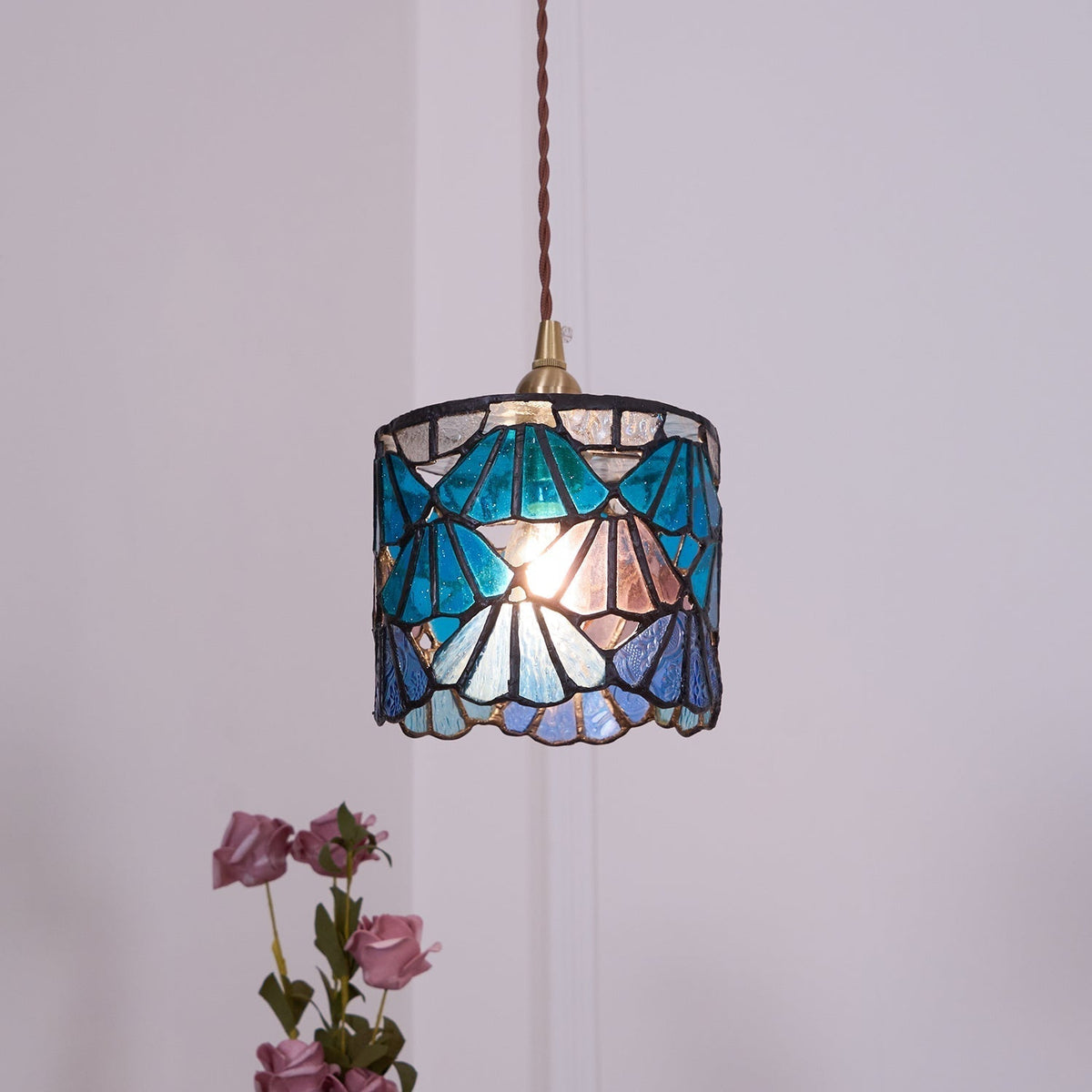 Pendant Light With Brass Accents And Glass Shade For Warm Glow