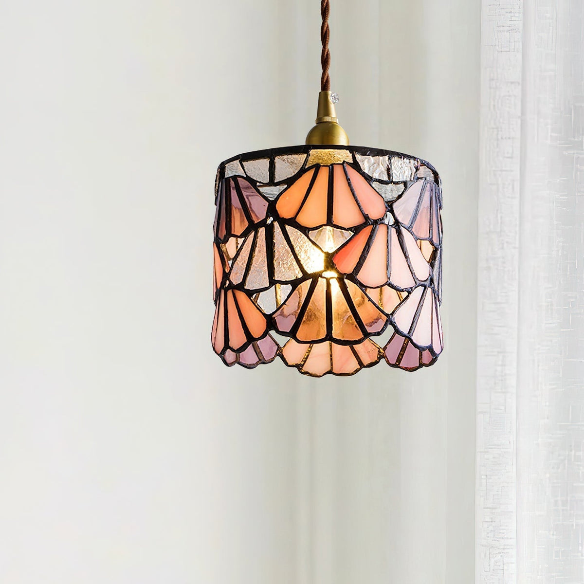 Pendant Light With Brass Accents And Glass Shade For Warm Glow