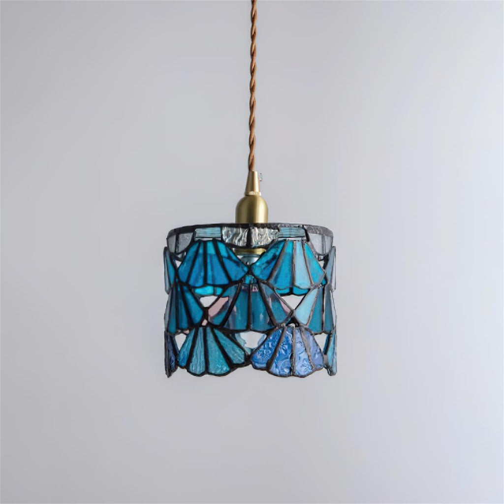 Pendant Light With Brass Accents And Glass Shade For Warm Glow