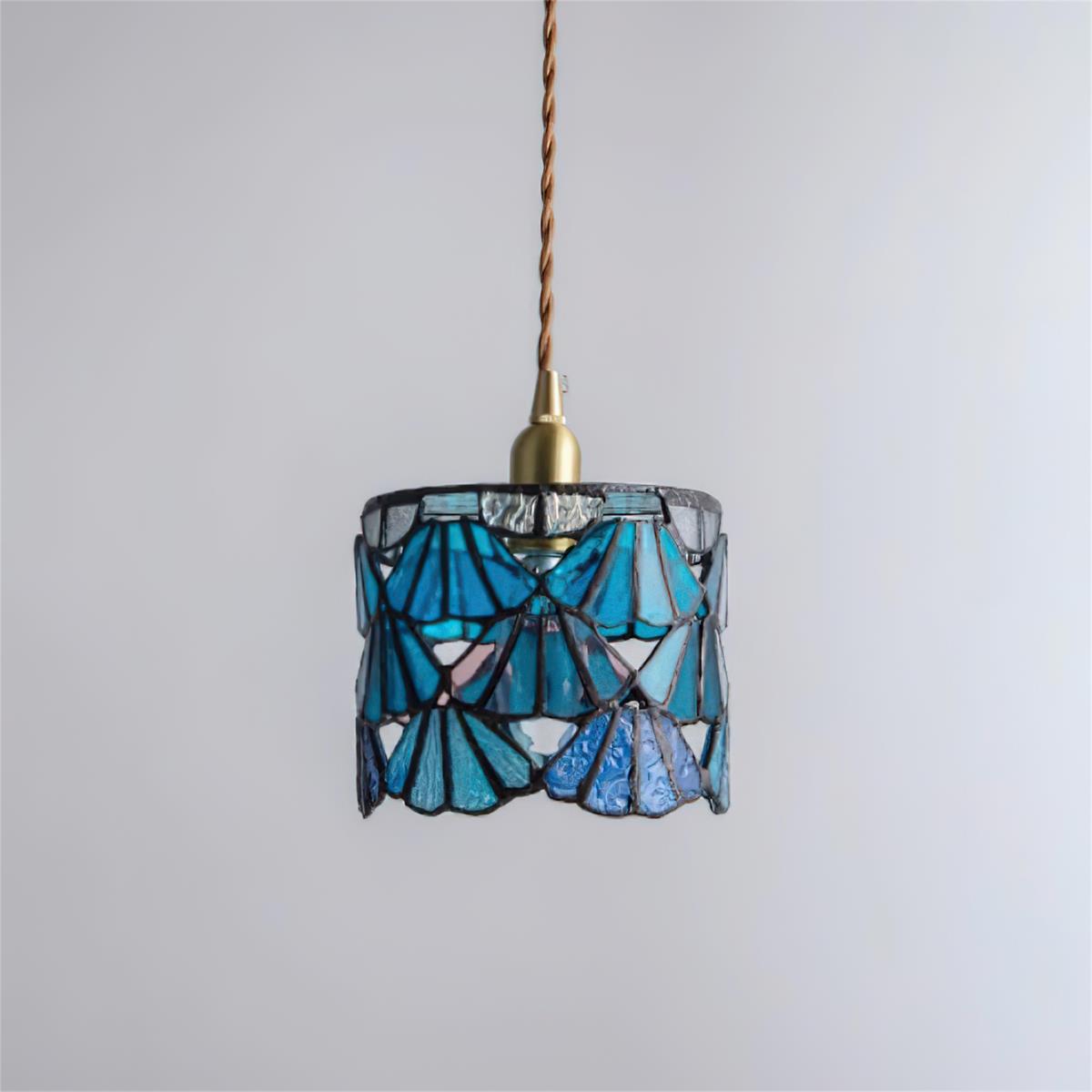Pendant Light With Brass Accents And Glass Shade For Warm Glow