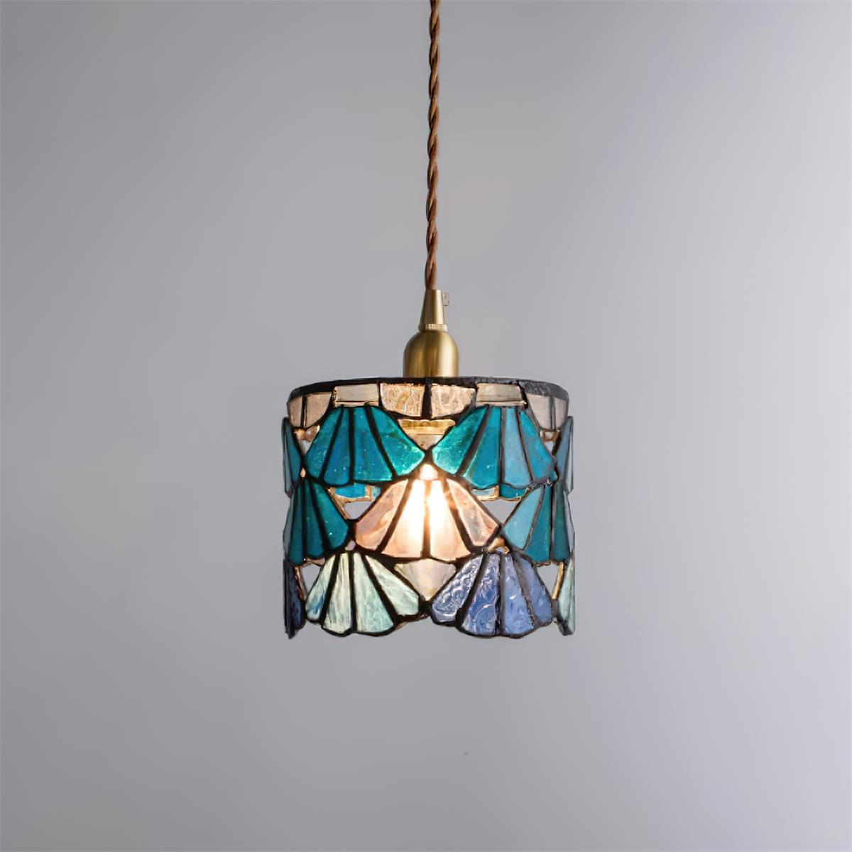 Pendant Light With Brass Accents And Glass Shade For Warm Glow