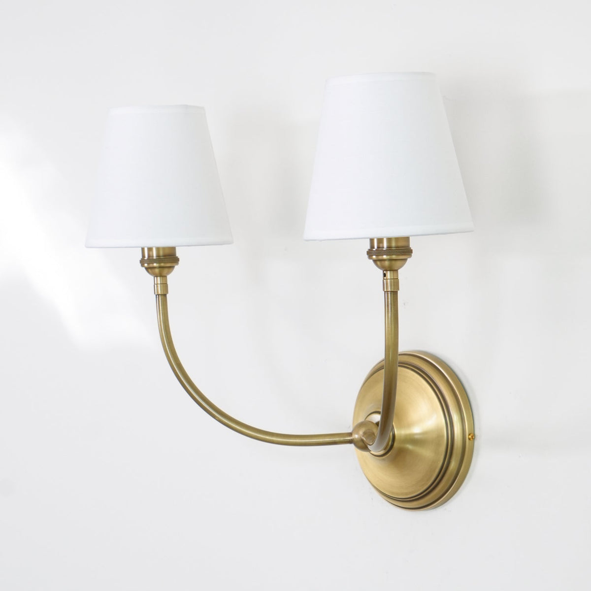 Black Brass Finish Curved Arms Wall Lamp With White Fabric Shades