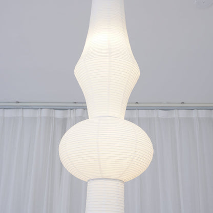 Vertical Sculptural Pendant Light With Warm Paper Glow