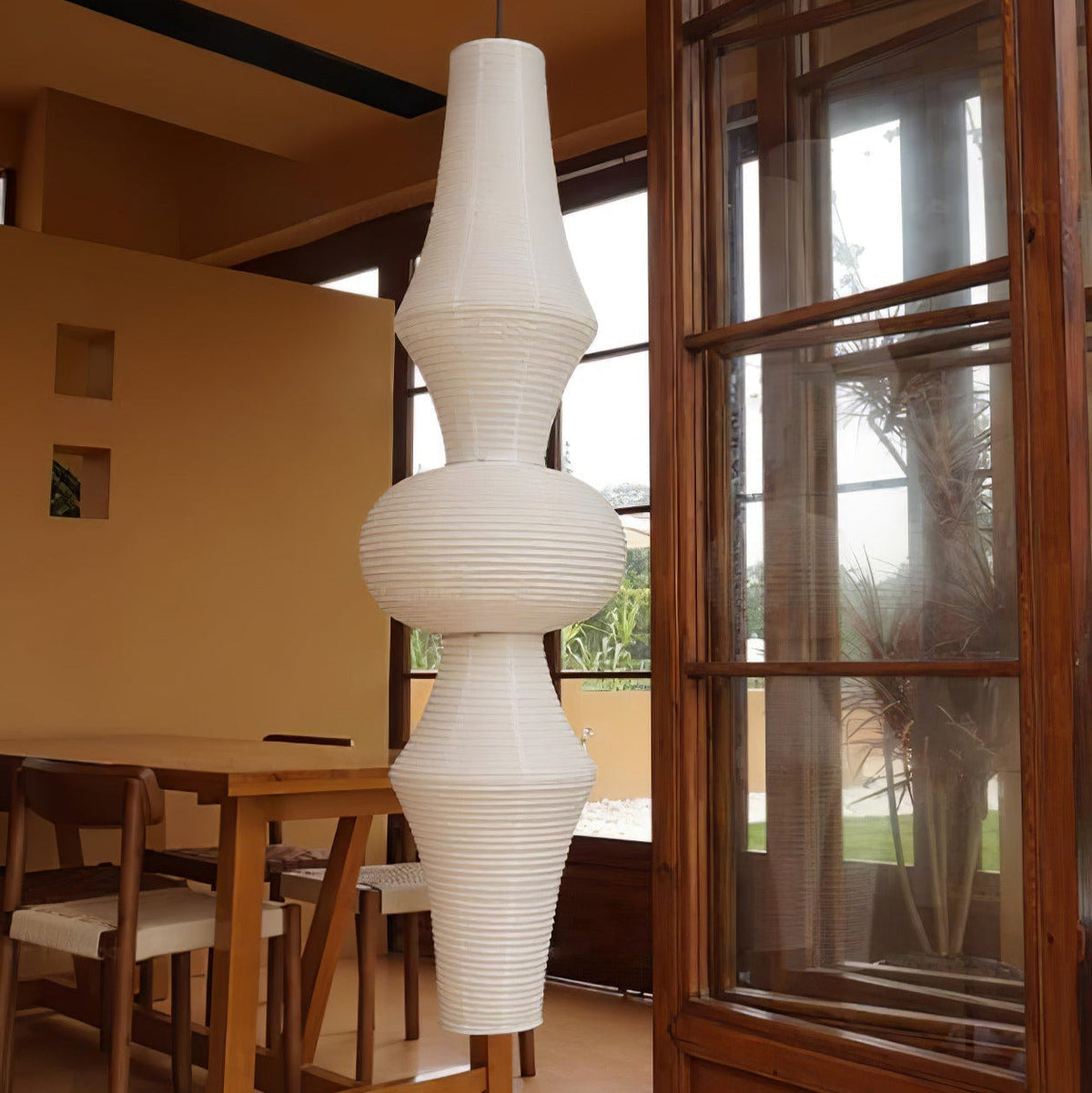 Vertical Sculptural Pendant Light With Warm Paper Glow