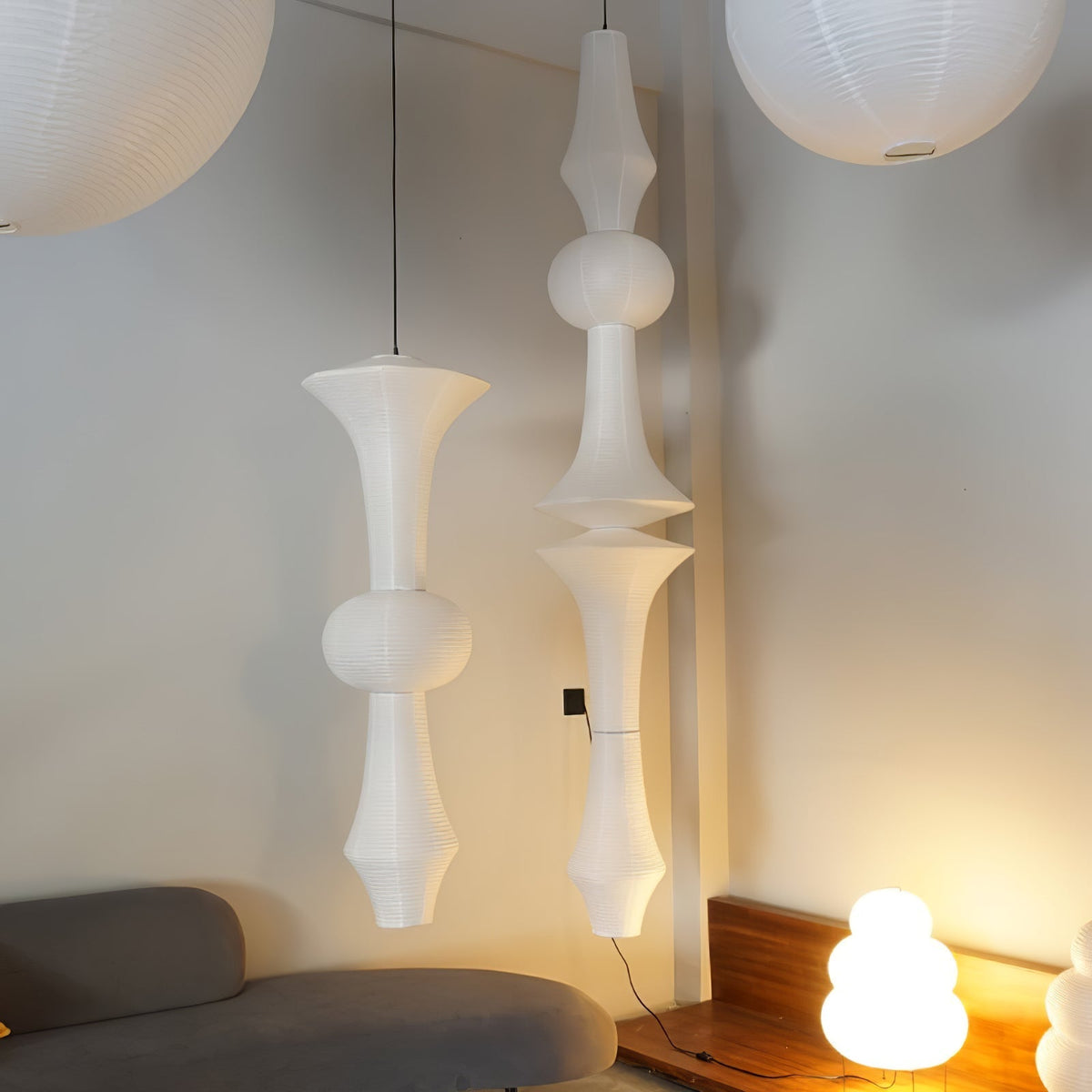 Vertical Sculptural Pendant Light With Warm Paper Glow