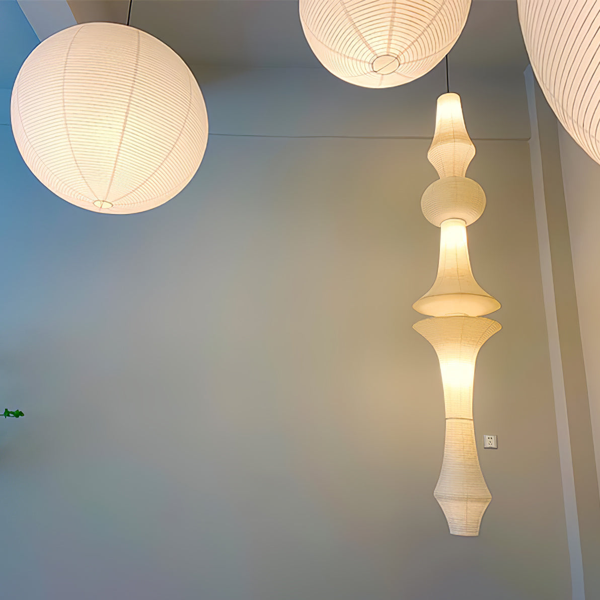 Vertical Sculptural Pendant Light With Warm Paper Glow