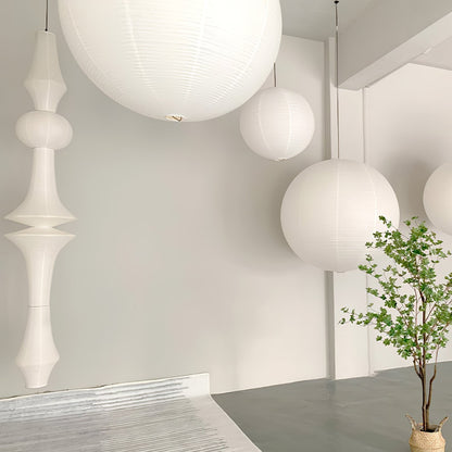 Vertical Sculptural Pendant Light With Warm Paper Glow