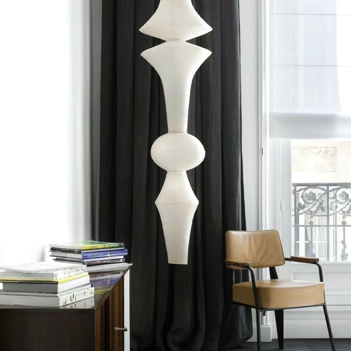 Vertical Sculptural Pendant Light With Warm Paper Glow